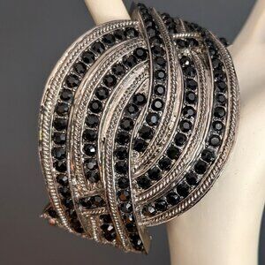 Gray metal hinge closure bracelet with black bead detail